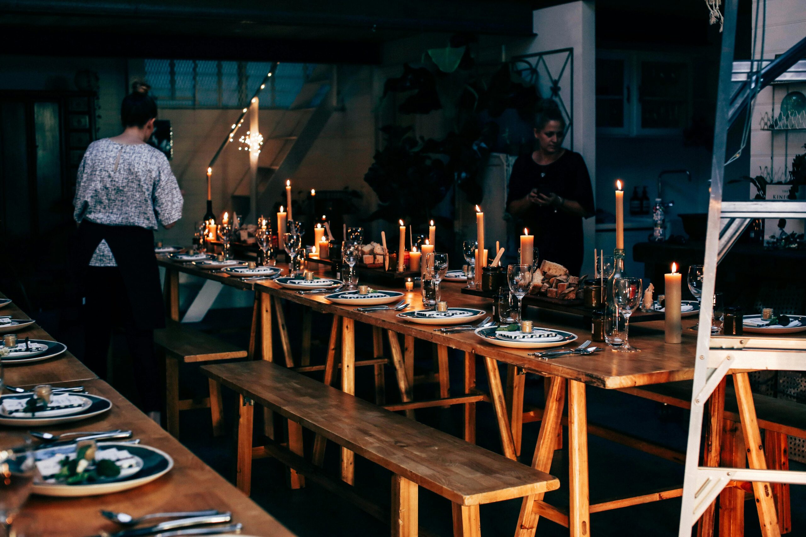 wooden table with setting for wedding reception